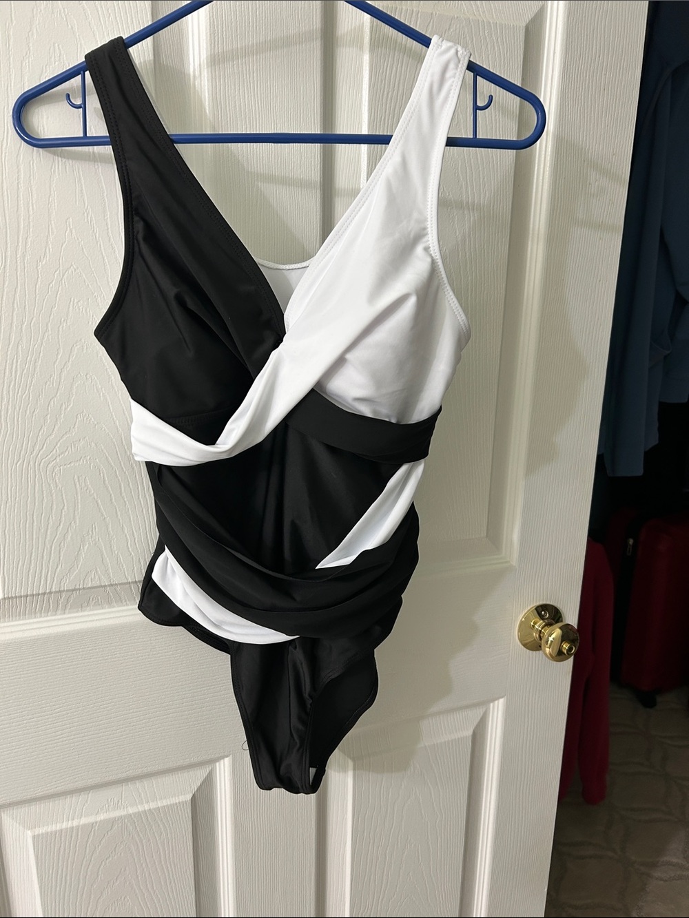 Black & White One-Piece Swimsuit size M. Ruched, wide straps, tummy control.